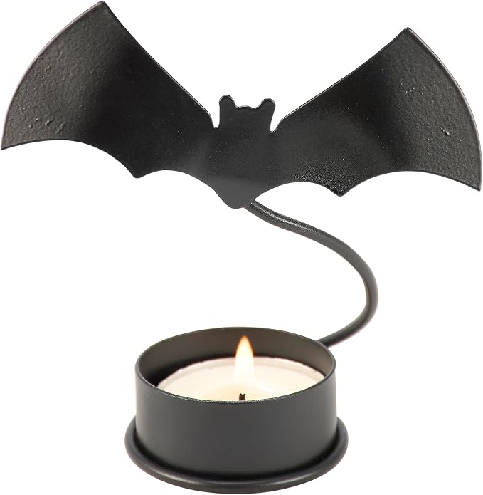Primitives by Kathy Decorative Candle Holder, from Our Halloween Collection, with a Metal bat Cutout Attached to a Metal piece, Gives Appearance of a Flying bat Above the Base and Candle - skull candle